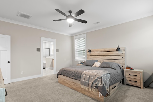 carpeted bedroom with ensuite bathroom, crown molding, and ceiling fan