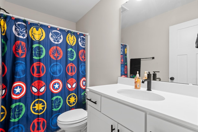 bathroom with vanity and toilet