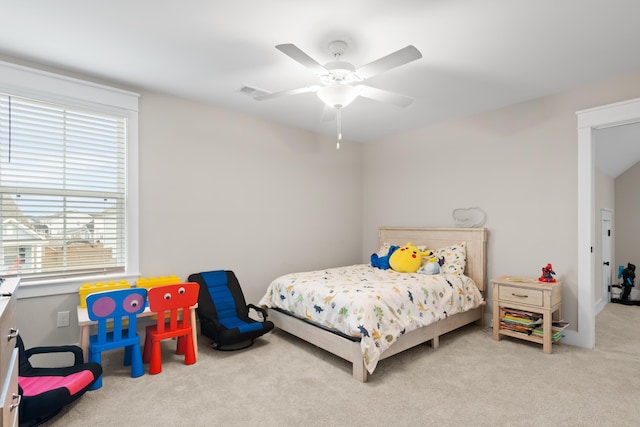 bedroom featuring light carpet and ceiling fan