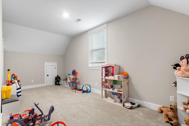 recreation room featuring carpet flooring and lofted ceiling