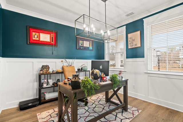 office with a notable chandelier, wood-type flooring, and crown molding