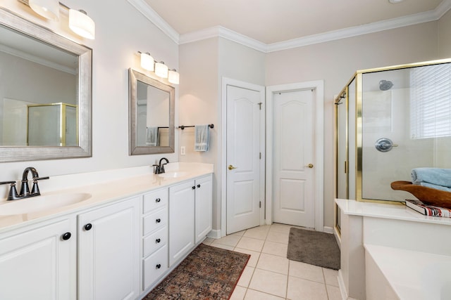 bathroom featuring a stall shower, crown molding, and a sink