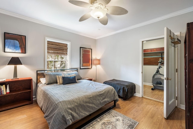 bedroom featuring light wood finished floors, baseboards, ornamental molding, and ceiling fan