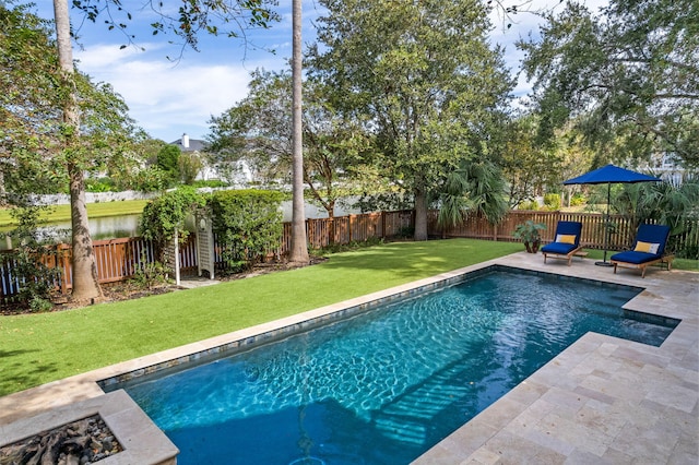 view of pool featuring a patio area, a fenced backyard, a fenced in pool, and a yard