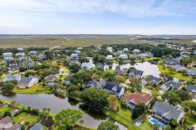 drone / aerial view featuring a water view and a residential view