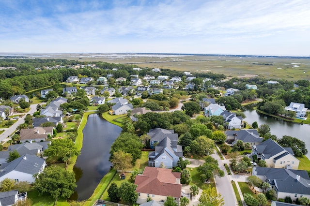 birds eye view of property with a residential view and a water view