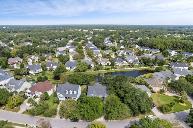 drone / aerial view featuring a water view and a residential view