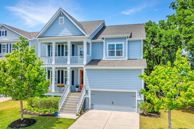 2234 Mother Of Pearl Dr, Mount Pleasant, SC 29466 - view of front of home featuring covered porch, a garage, a balcony, and a shingled roof