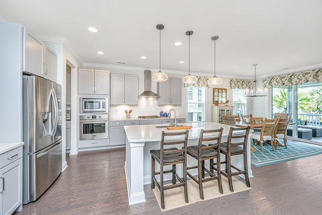 2234 Mother Of Pearl Dr, Mount Pleasant, SC 29466 - kitchen with appliances with stainless steel finishes, wall chimney range hood, a sink, light countertops, and crown molding