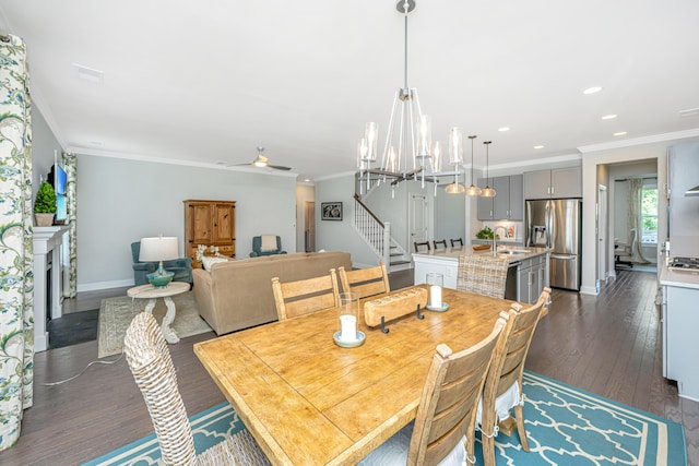 2234 Mother Of Pearl Dr, Mount Pleasant, SC 29466 - dining room with a chandelier, dark wood-type flooring, crown molding, baseboards, and recessed lighting