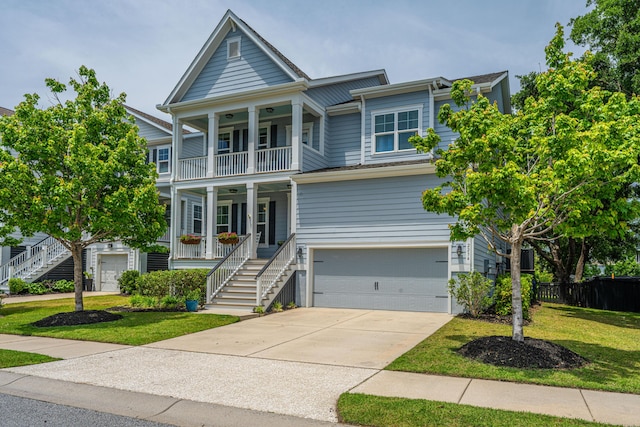 2234 Mother Of Pearl Dr, Mount Pleasant, SC 29466 - view of front facade featuring a porch, a garage, a balcony, stairs, and concrete driveway