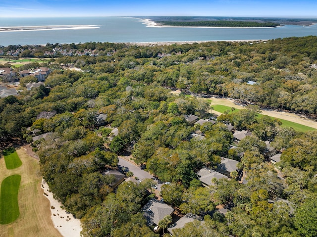 bird's eye view with a forest view and a water view