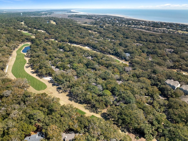 birds eye view of property with a water view and a wooded view