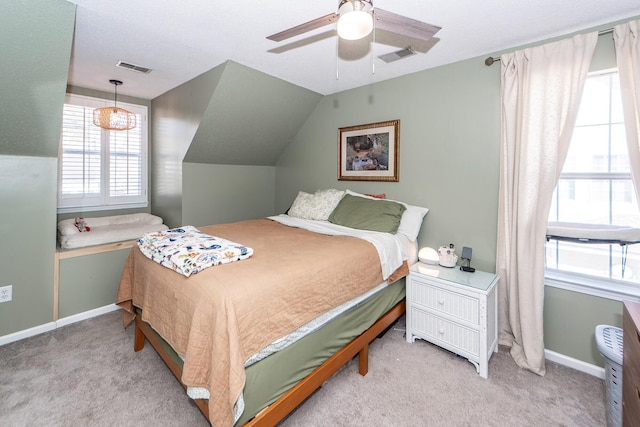 carpeted bedroom featuring lofted ceiling and ceiling fan