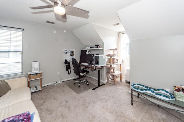 office space with ceiling fan, light colored carpet, and lofted ceiling