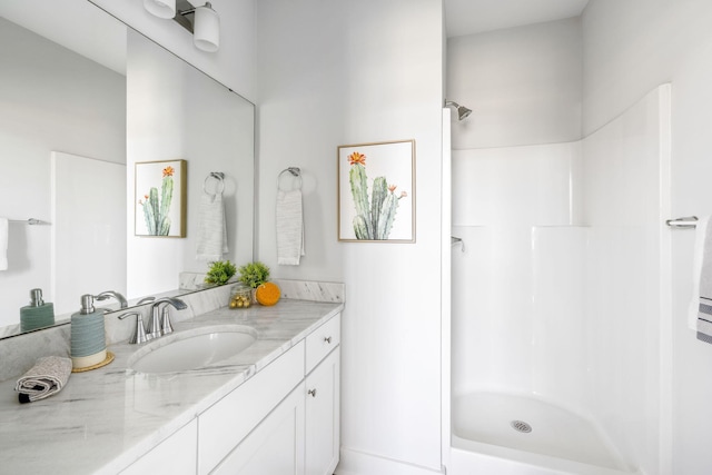 full bath with a shower and vanity