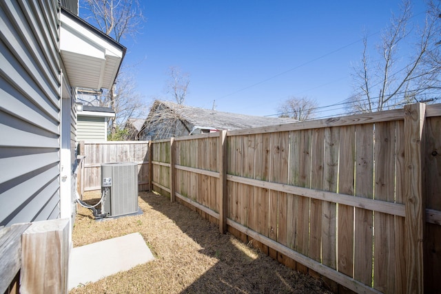 view of yard featuring a fenced backyard and cooling unit