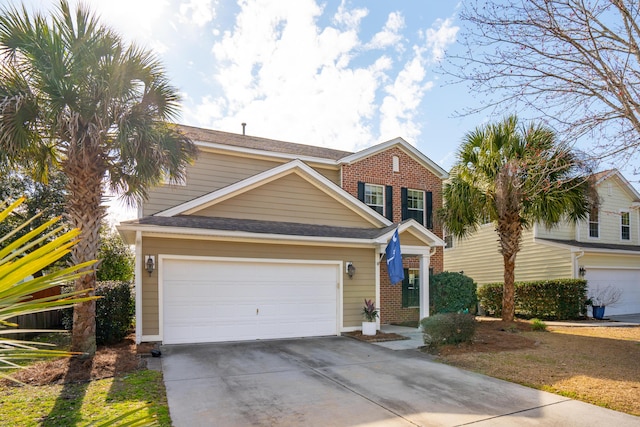 view of front of house with a garage, driveway, and brick siding