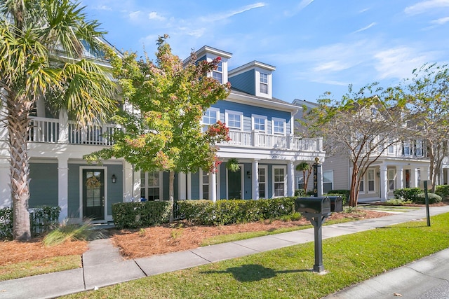 view of front of home with a balcony