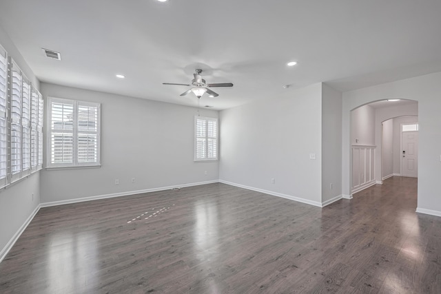 empty room featuring dark hardwood / wood-style floors and ceiling fan