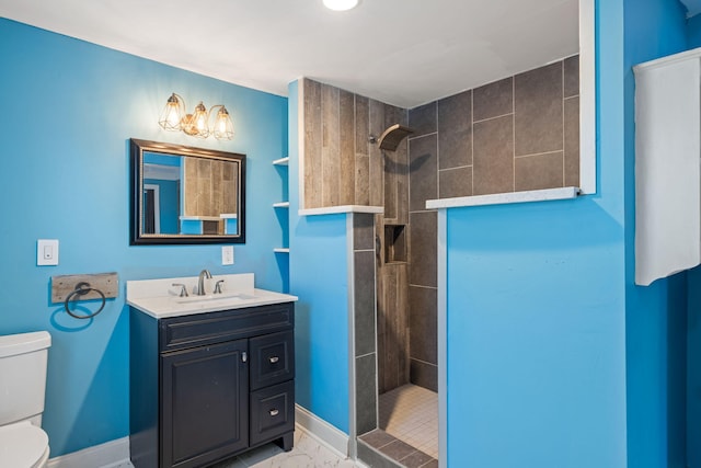 bathroom with toilet, marble finish floor, a walk in shower, baseboards, and vanity