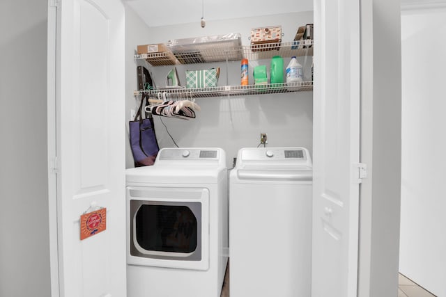 laundry room with laundry area and washer and clothes dryer