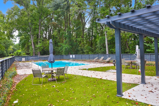 community pool featuring a yard, a patio, fence, and a pergola