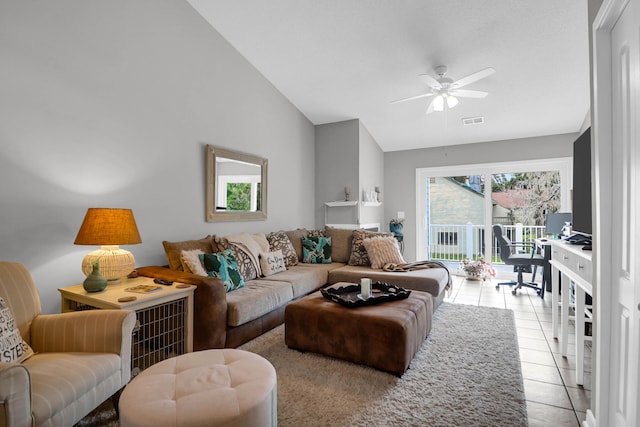 living area with light tile patterned floors, visible vents, vaulted ceiling, and a ceiling fan