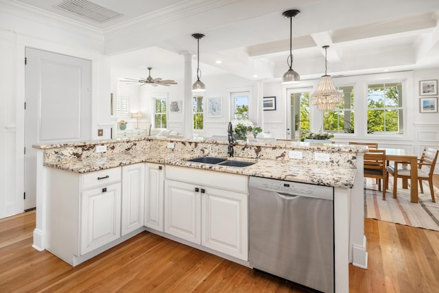 1543 Wando Landing St, Charleston, SC 29492 - kitchen with stainless steel dishwasher, a sink, a decorative wall, light wood-type flooring, and white cabinets
