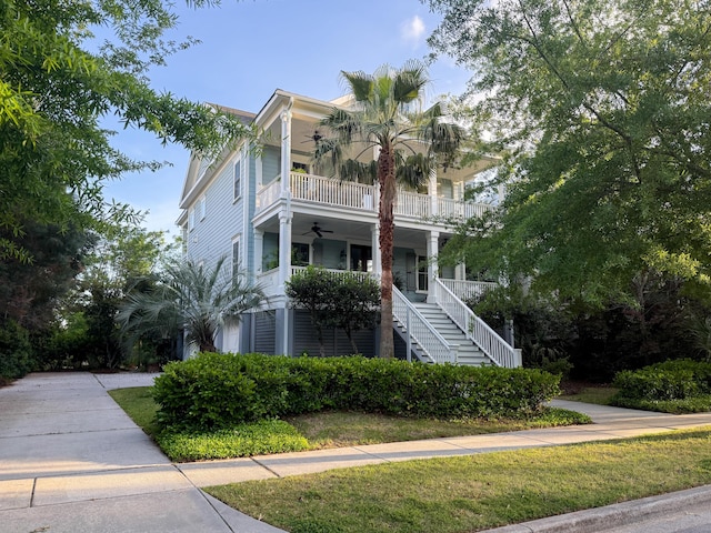 1543 Wando Landing St, Charleston, SC 29492 - view of front of home with ceiling fan, a balcony, stairs, covered porch, and a front yard