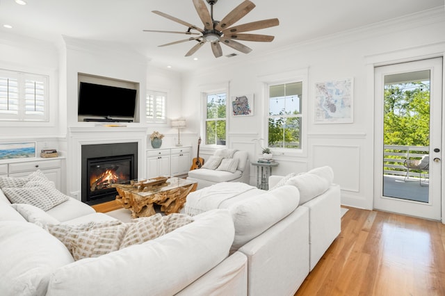 1543 Wando Landing St, Charleston, SC 29492 - living room with a ceiling fan, healthy amount of natural light, recessed lighting, a glass covered fireplace, and light wood finished floors