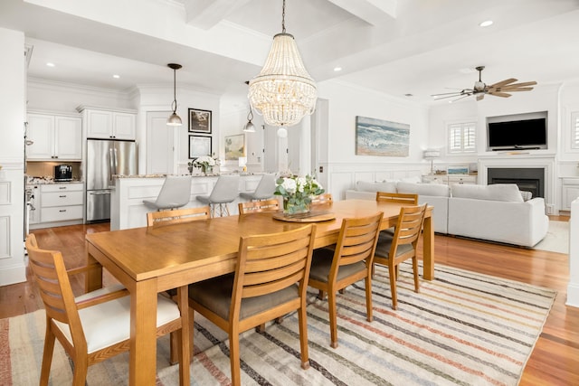 1543 Wando Landing St, Charleston, SC 29492 - dining space with light wood-style floors, ornamental molding, ceiling fan, a chandelier, and recessed lighting