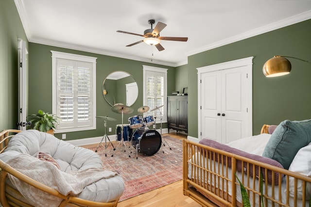 1543 Wando Landing St, Charleston, SC 29492 - bedroom with ornamental molding, wood finished floors, baseboards, a closet, and a ceiling fan