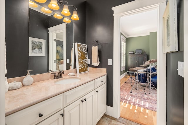 1543 Wando Landing St, Charleston, SC 29492 - bathroom with baseboards, vanity, and ornamental molding