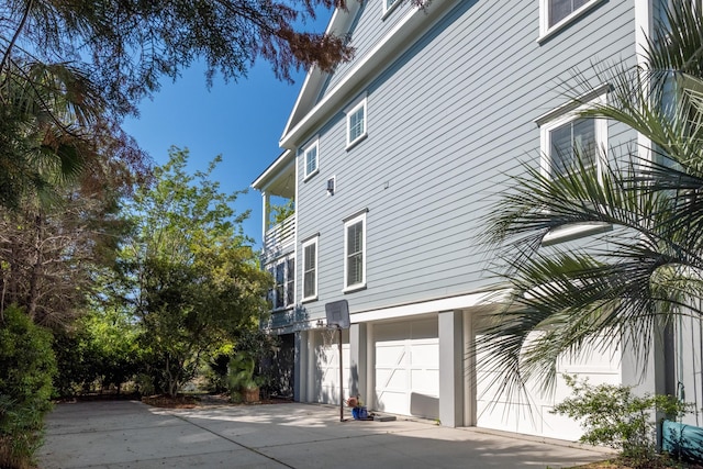 1543 Wando Landing St, Charleston, SC 29492 - view of side of home with concrete driveway and an attached garage