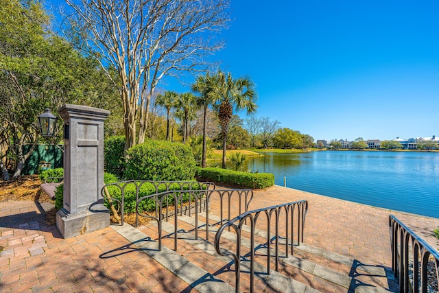 1543 Wando Landing St, Charleston, SC 29492 - dock area featuring a water view and a patio
