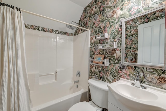 bathroom featuring shower / bath combination with curtain, vanity, toilet, and wallpapered walls