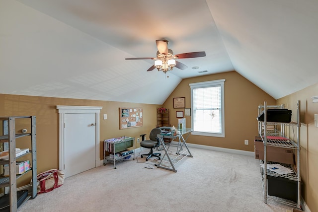 interior space with carpet, visible vents, vaulted ceiling, and ceiling fan