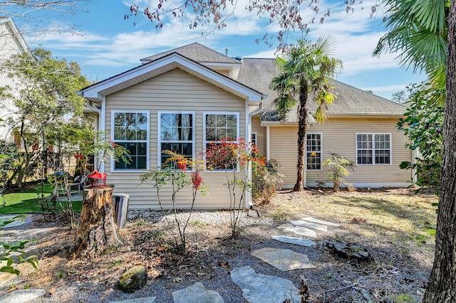 view of front of home with a shingled roof