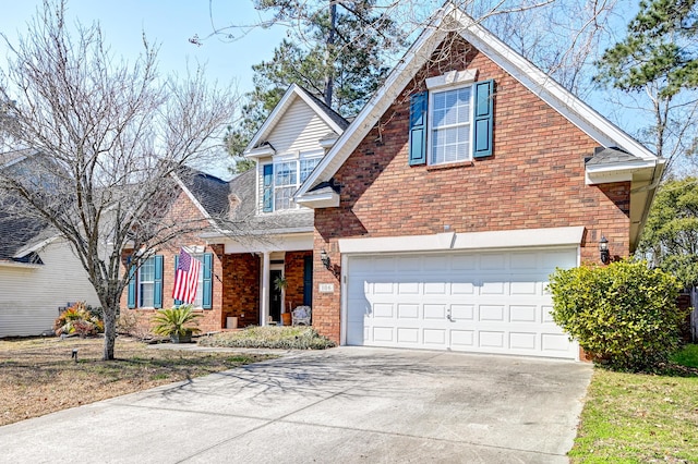 traditional-style home featuring concrete driveway, brick siding, and an attached garage