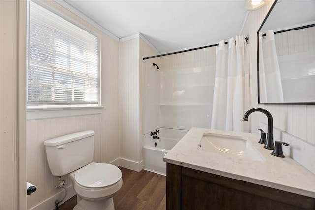 bathroom featuring shower / bath combo with shower curtain, toilet, wood finished floors, and vanity