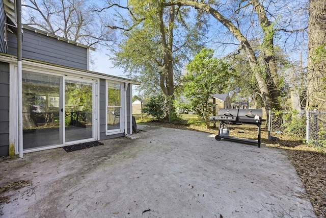 view of patio / terrace featuring fence