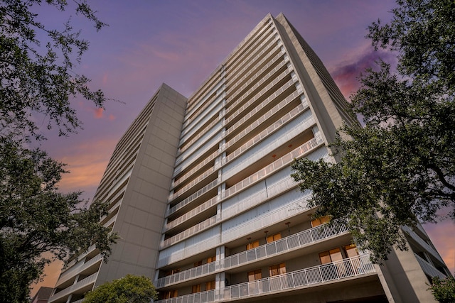 view of outdoor building at dusk