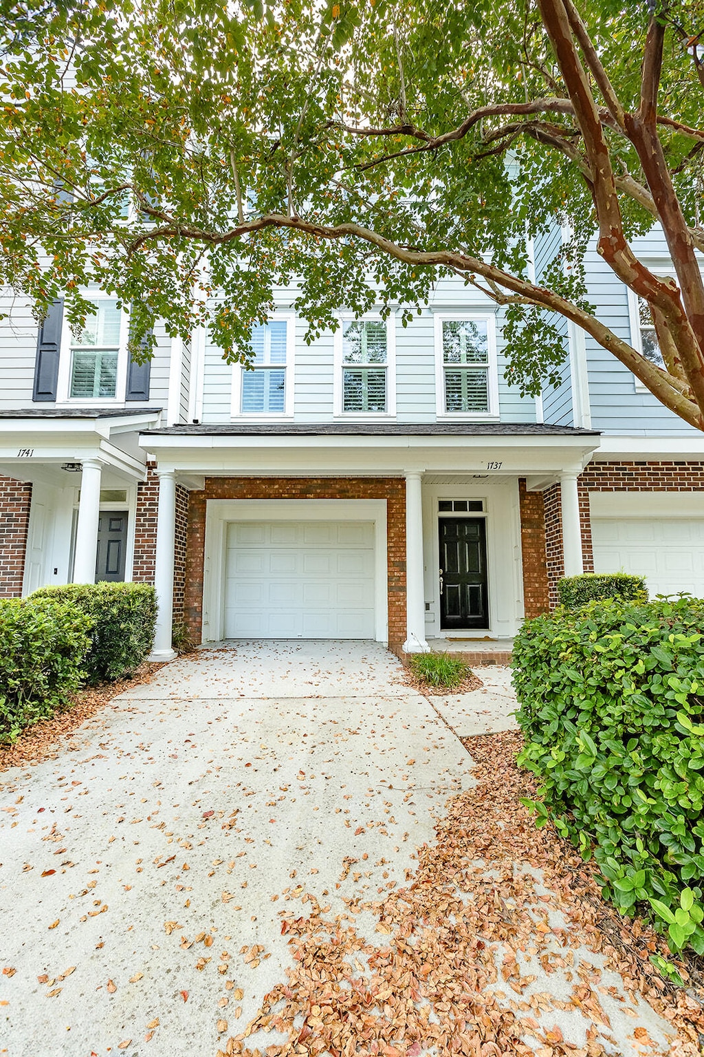 view of front of property with a garage and a porch