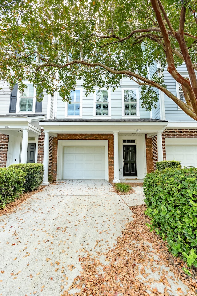 view of front of property with a garage and a porch