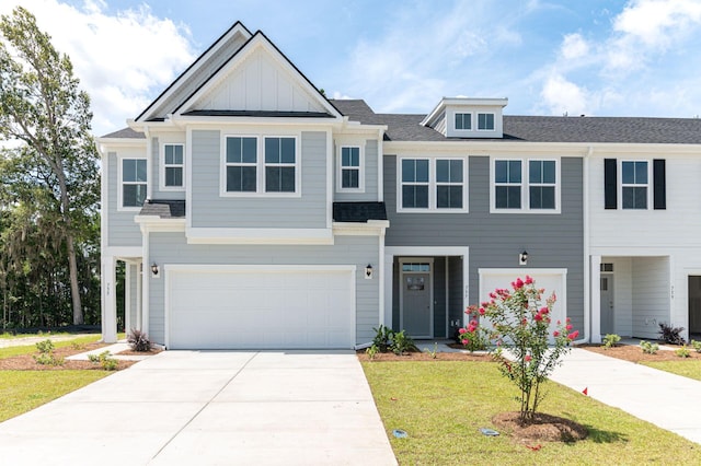 view of front of property with a garage and a front yard