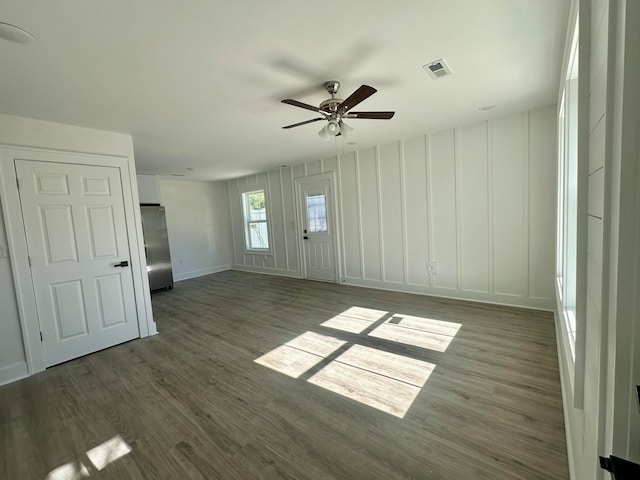 spare room with ceiling fan and dark hardwood / wood-style flooring