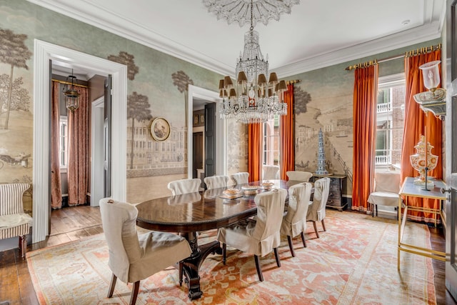 dining space with light hardwood / wood-style floors, crown molding, and a notable chandelier