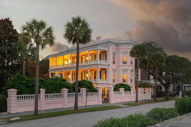 view of front of property with a balcony