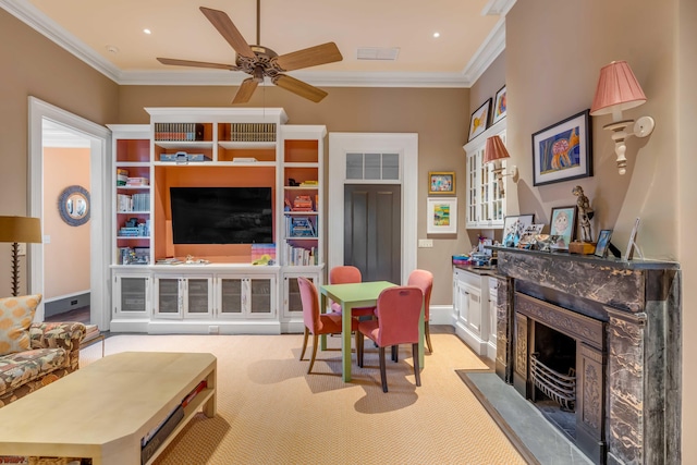 living room with a premium fireplace, ornamental molding, light carpet, and ceiling fan